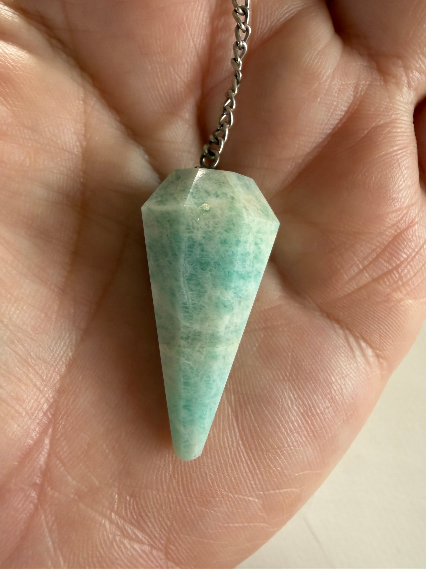 Amazonite pendulum crystal used for divination, intuition and energy work.