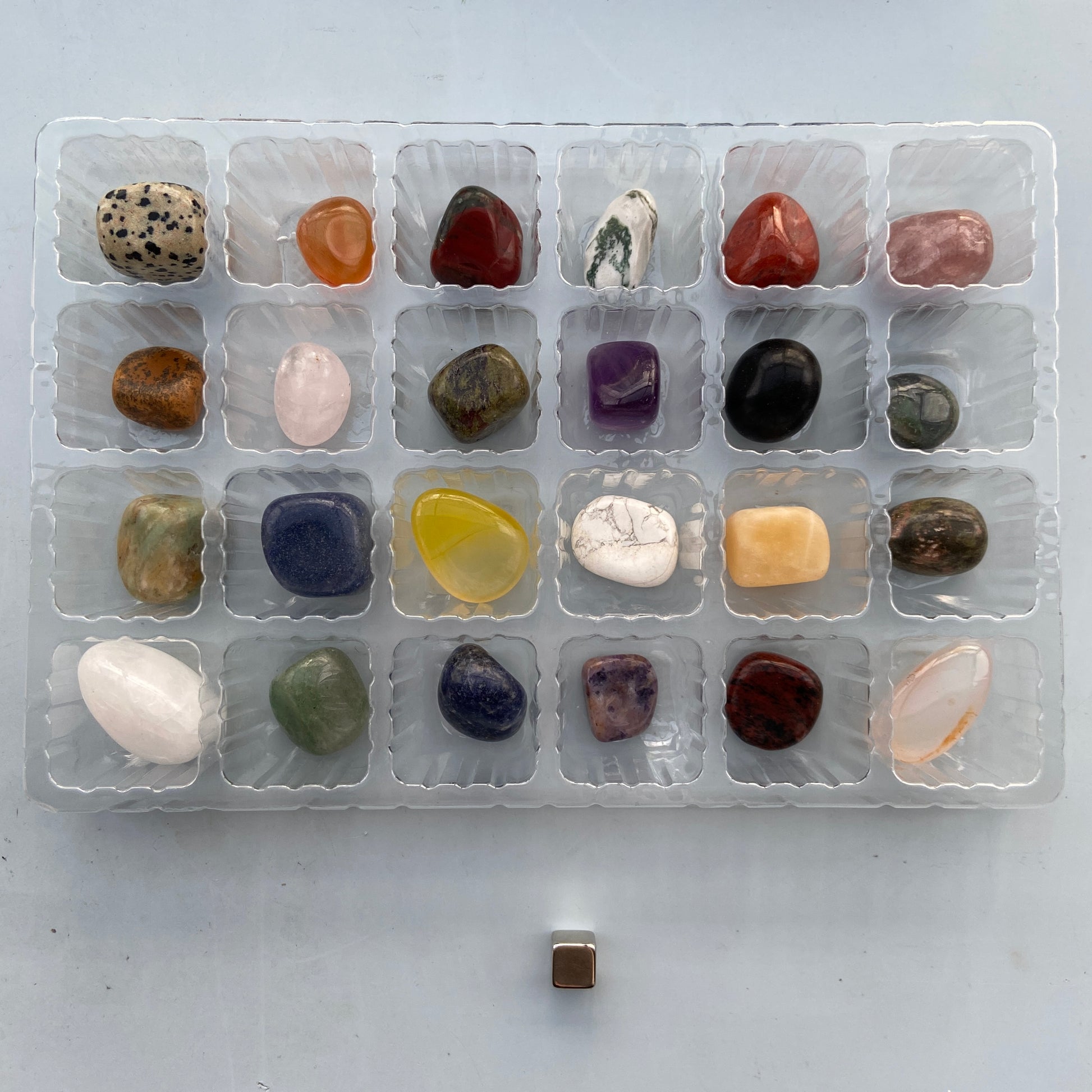 Crystal advent calendar for kids with pocket stones and crystal descriptions behind every door.