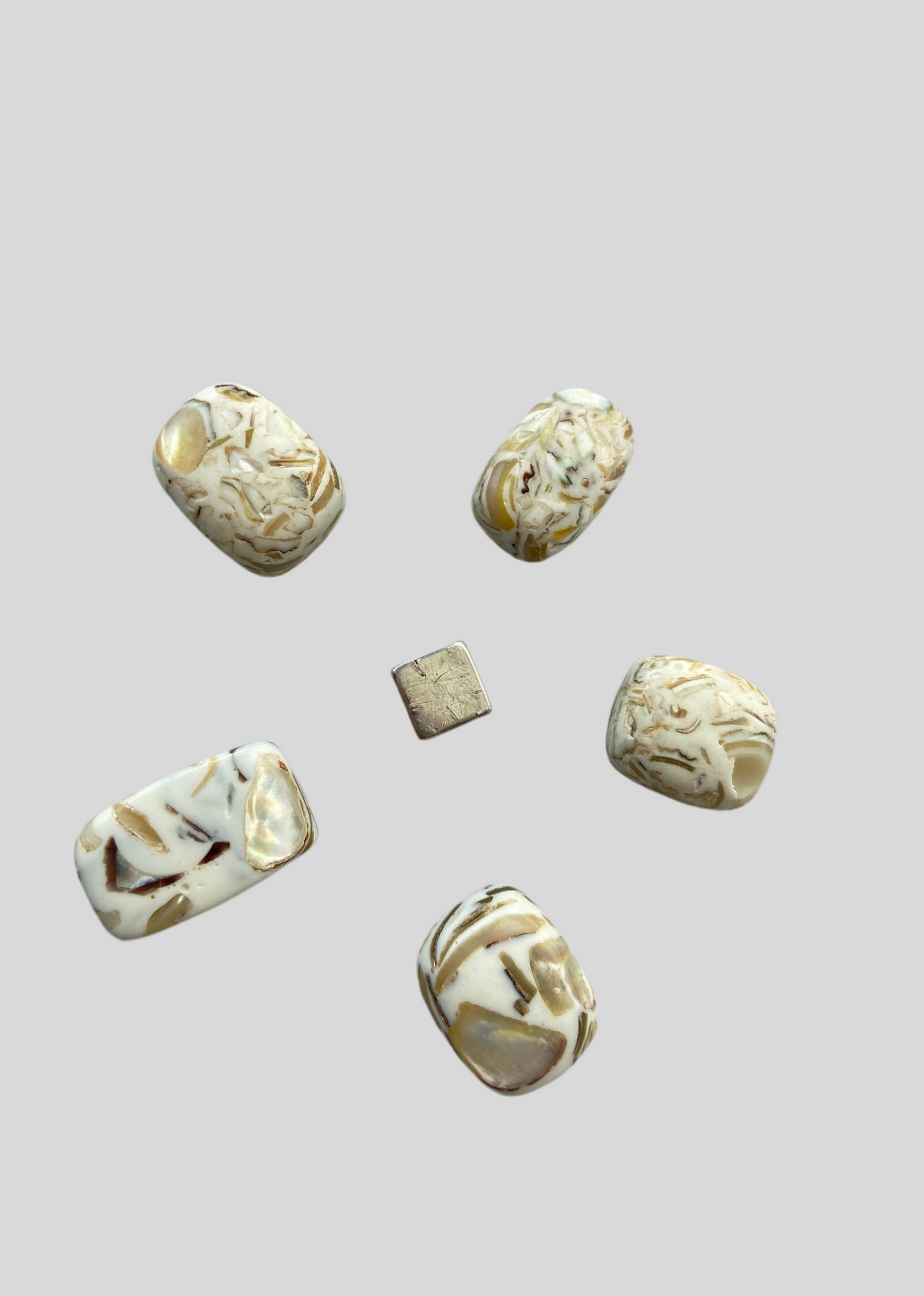 Perlemor-resin – symbol på moderlig omsorg, varme og støtte.