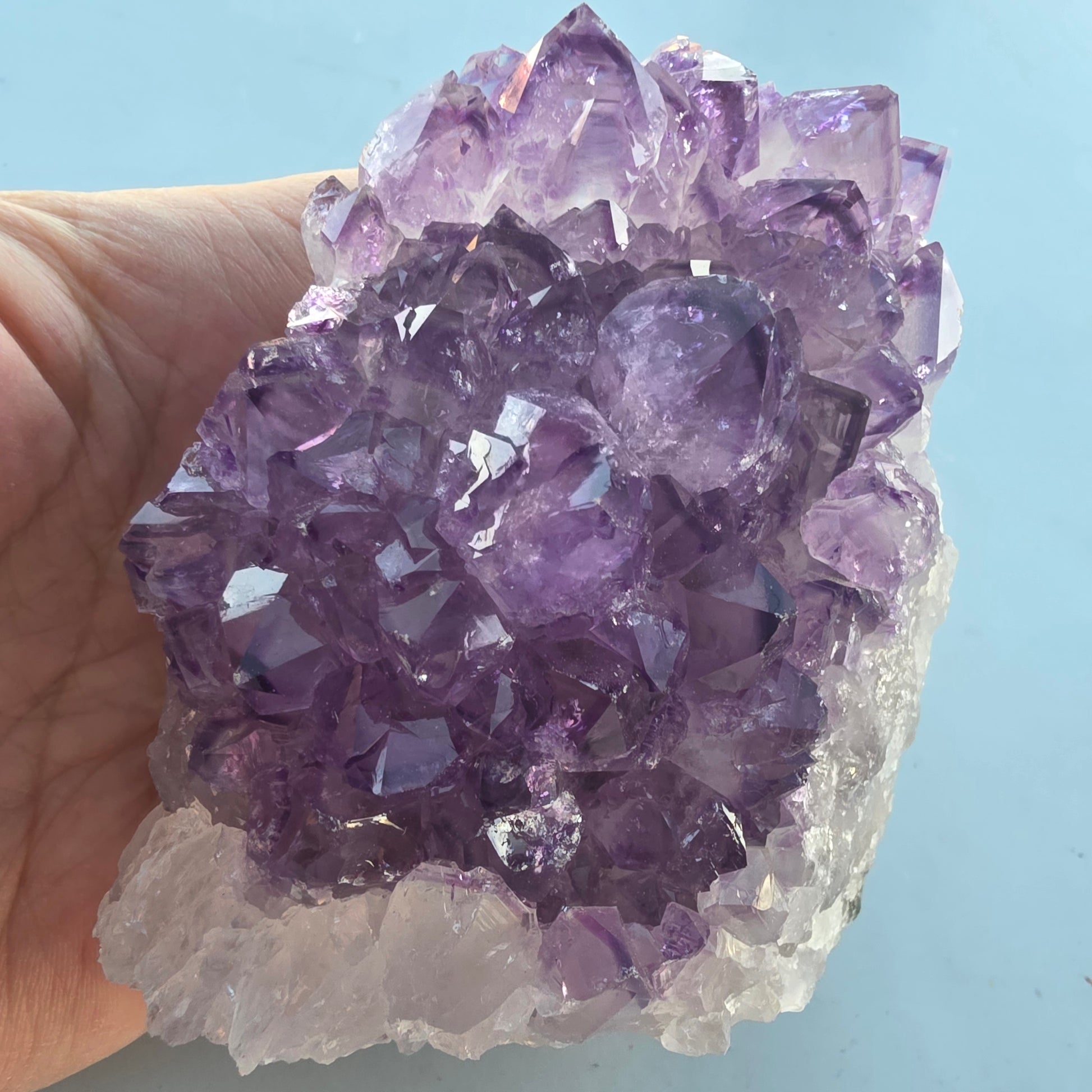 Raw amethyst point crystal with natural formation.
